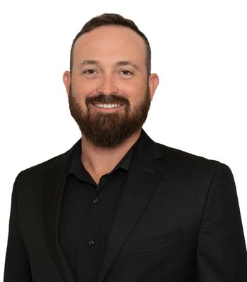 Portrait of Christoffer Calhoon, REALTOR®.